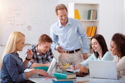 Teacher and students with laptops